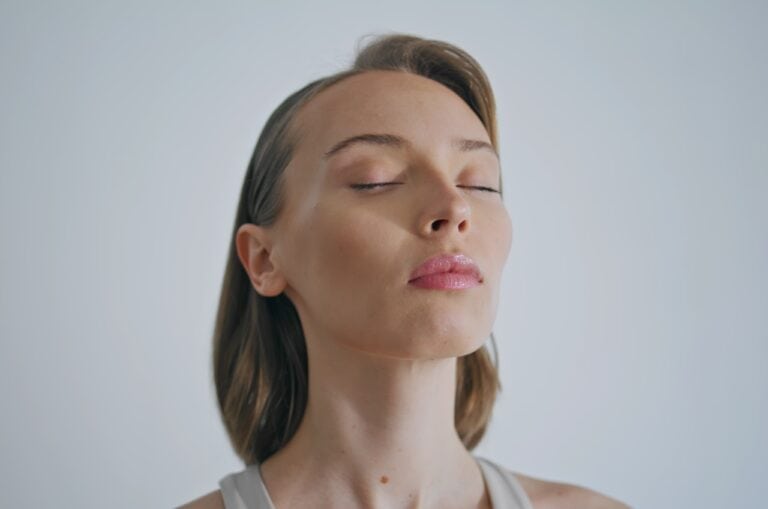 woman eyes closed feeling the moment